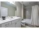 Bathroom with tiled shower/bathtub, vanity and sink, and toilet with matching hardware at 4202 Morrison Way # 9, Atlanta, GA 30341