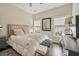 Bedroom with a plush bed, natural light, and hardwood floors at 4202 Morrison Way # 9, Atlanta, GA 30341