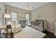 Bright Bedroom featuring neutral colors, a crib, a cozy chair, and a patterned rug at 4202 Morrison Way # 9, Atlanta, GA 30341