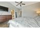 Comfortable main bedroom features a flat screen tv, hardwood floors, and an ensuite bathroom at 4202 Morrison Way # 9, Atlanta, GA 30341
