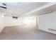 Unfinished basement with carpet and bright lighting, ready for customization at 746 Gladstone Nw Rd, Atlanta, GA 30318
