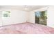 Empty bedroom with sliding glass door and pink carpet at 746 Gladstone Nw Rd, Atlanta, GA 30318