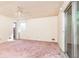 Empty bedroom with sliding glass door and pink carpet at 746 Gladstone Nw Rd, Atlanta, GA 30318