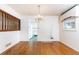 Bright dining room features hardwood floors, chandelier, and doorway to kitchen at 746 Gladstone Nw Rd, Atlanta, GA 30318