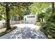Lovely two-story home boasts lush landscaping, a two-car garage and a welcoming front entrance at 746 Gladstone Nw Rd, Atlanta, GA 30318