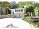 Charming two-story home with a manicured front yard, two-car garage and inviting front entrance at 746 Gladstone Nw Rd, Atlanta, GA 30318