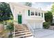 Two-story white home featuring a green front door and a two-car garage at 746 Gladstone Nw Rd, Atlanta, GA 30318