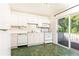 Efficient kitchen with white appliances, ample cabinetry, and sliding glass door to deck at 746 Gladstone Nw Rd, Atlanta, GA 30318