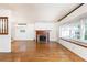 Open living room with hardwood floors, a fireplace, and natural light at 746 Gladstone Nw Rd, Atlanta, GA 30318