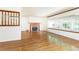 Spacious living room with hardwood floors, fireplace, and large windows at 746 Gladstone Nw Rd, Atlanta, GA 30318