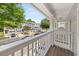 A view from the balcony of townhomes with garages and a landscaped common area at 1168 Liberty Nw Pkwy, Atlanta, GA 30318