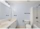 Bathroom featuring a double sink vanity, shower and tub combo, toilet, and towel racks at 1168 Liberty Nw Pkwy, Atlanta, GA 30318