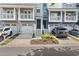 Townhomes with attached garages, private balconies, dark front doors, and manicured landscaping at 1168 Liberty Nw Pkwy, Atlanta, GA 30318