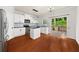 Open concept kitchen featuring white cabinets, stainless appliances, dark countertops, and outdoor access at 1168 Liberty Nw Pkwy, Atlanta, GA 30318