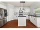 Kitchen with white cabinets, stainless steel appliances, dark countertops, and an island at 1168 Liberty Nw Pkwy, Atlanta, GA 30318