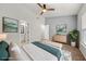 This bright main bedroom features geometric wall art and an attached bathroom and window at 1168 Liberty Nw Pkwy, Atlanta, GA 30318