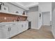 Finished basement featuring a bar area with modern cabinetry and a wine cooler at 159 Sunshower Rdg, Canton, GA 30114