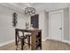 Basement bar area features a small table with a wine rack and chalkboard accent for a cozy entertaining space at 159 Sunshower Rdg, Canton, GA 30114