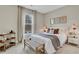 Cozy bedroom with a large window, neutral tones, and stylish decor at 159 Sunshower Rdg, Canton, GA 30114