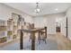 Light filled bonus room with a vaulted ceiling, wood floors, and a built in storage area with woven baskets at 159 Sunshower Rdg, Canton, GA 30114