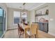 Inviting dining room features natural light, modern light fixture, and custom built-ins at 159 Sunshower Rdg, Canton, GA 30114