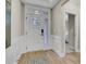 Inviting entryway showcasing white wainscoting, wood floors, and a bedroom view at 159 Sunshower Rdg, Canton, GA 30114