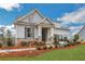 Attractive home with stone accents, a covered porch, and a garage with glass panels at 159 Sunshower Rdg, Canton, GA 30114