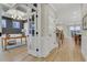 Hallway leading to an office space and dining room with elegant chandelier at 159 Sunshower Rdg, Canton, GA 30114