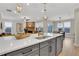 Open kitchen boasts a large island with sink and dishwasher and an eat-in dining area at 159 Sunshower Rdg, Canton, GA 30114