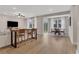 Open-concept living room with hardwood floors, recessed lighting, and stylish furniture at 159 Sunshower Rdg, Canton, GA 30114