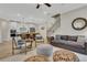 Open concept living room with view into kitchen and modern decor at 159 Sunshower Rdg, Canton, GA 30114