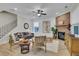 Inviting living room with a brick fireplace, ceiling fan, and wood flooring at 159 Sunshower Rdg, Canton, GA 30114