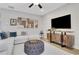Comfortable living room with modern decor, stylish entertainment center, and cozy seating at 159 Sunshower Rdg, Canton, GA 30114