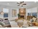 Cozy living room features a ceiling fan, fireplace, and modern decor at 159 Sunshower Rdg, Canton, GA 30114