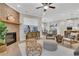Bright living room with a cozy brick fireplace and view into kitchen at 159 Sunshower Rdg, Canton, GA 30114