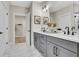 Bright main bathroom with double vanity, open closet, and marble floors at 159 Sunshower Rdg, Canton, GA 30114