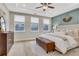 Spacious main bedroom with a tray ceiling, bench, and lots of windows at 159 Sunshower Rdg, Canton, GA 30114