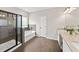 Modern bathroom featuring a glass-enclosed shower, soaking tub, and dual sink vanity at 191 Madison Bnd, Woodstock, GA 30188