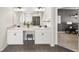 Bright bathroom featuring double vanity with stone countertops and views into the main bedroom at 191 Madison Bnd, Woodstock, GA 30188