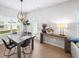 Cozy dining area with modern lighting and views to backyard at 191 Madison Bnd, Woodstock, GA 30188