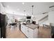 Open concept kitchen featuring island, modern appliances, and open dining at 191 Madison Bnd, Woodstock, GA 30188