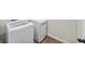Laundry area featuring a white washing machine and dryer at 191 Madison Bnd, Woodstock, GA 30188