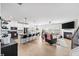 Open-concept living room with fireplace, kitchen, and modern finishes at 191 Madison Bnd, Woodstock, GA 30188