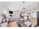 Open living space with dining area, kitchen, and fireplace, great for gatherings at 191 Madison Bnd, Woodstock, GA 30188