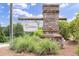 Chelsea neighborhood sign featuring a stone pillar and greenery at 191 Madison Bnd, Woodstock, GA 30188