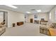 This is a furnished basement space with tan walls and neutral carpet at 241 Tweed Ct, Sugar Hill, GA 30518
