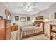 Bedroom with a full-size bed, wood furniture, and neutral walls at 241 Tweed Ct, Sugar Hill, GA 30518