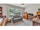 Comfortable room featuring large window and ample space for various furnishings at 241 Tweed Ct, Sugar Hill, GA 30518