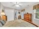 Bedroom with neutral walls, a wooden bed, and natural light at 241 Tweed Ct, Sugar Hill, GA 30518
