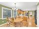 Eat-in kitchen with wood cabinets, a chandelier, and natural light from the window at 241 Tweed Ct, Sugar Hill, GA 30518